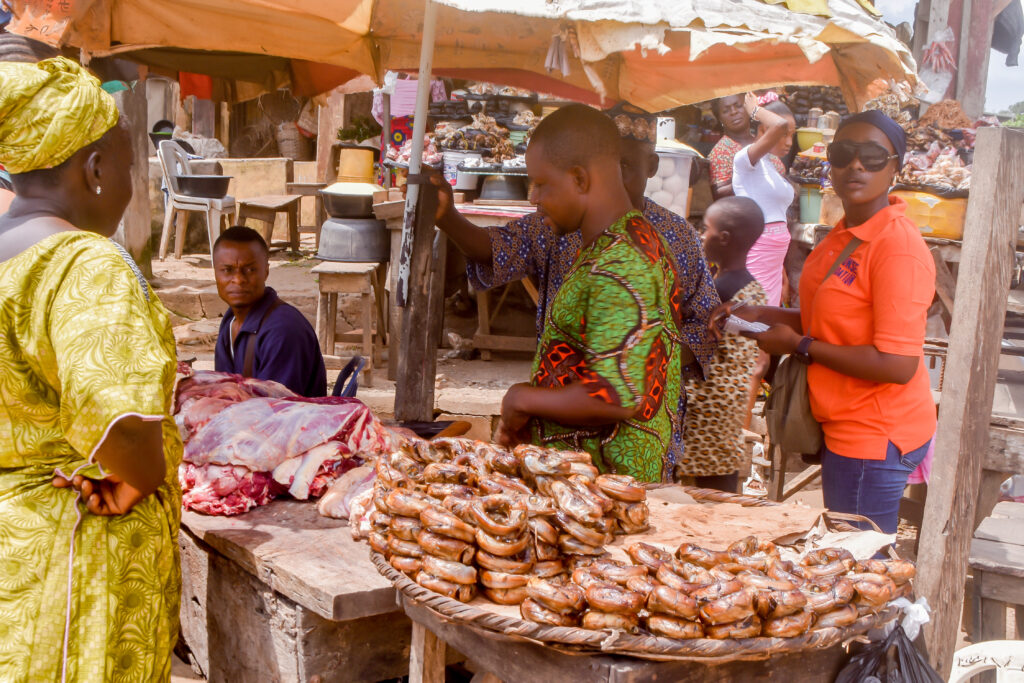 A market woman and her customer in Lagos